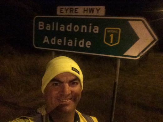 Gary at the Eyre Highway sign for Balladonia and Adelaide before dawn