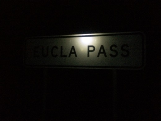 Eucla Pass sign lit in the dark
