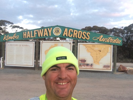 Gary in front of the Kimba Halfway Across Australia marker