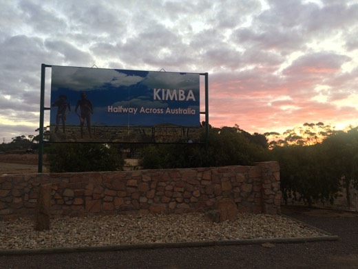Kimba sign saying Halfway Across Australia at sunset