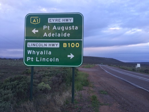 Road sign showing Port Augusta and Adelaide ahead with Whyalla and Port Lincoln to the right