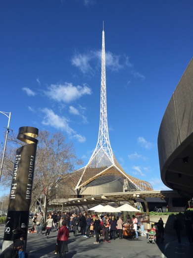 Melbourne Arts Centre spire and city buildings from Southbank