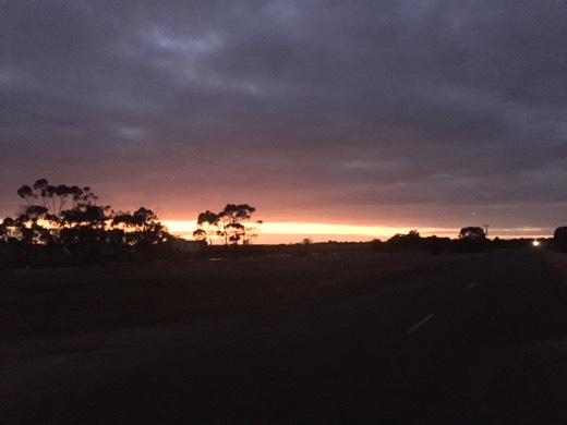 Dawn light under heavy clouds at the start of Day 81 toward Melbourne