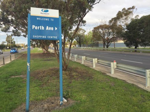 Roadside sign pointing to Perth Avenue in suburban Melbourne