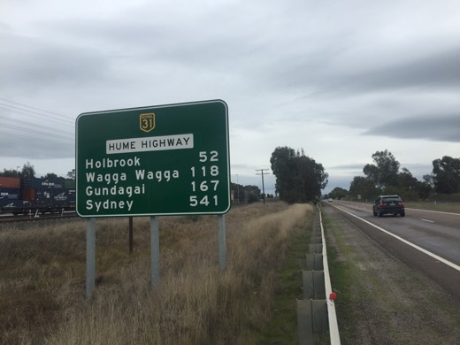 Road sign listing Holbrook, Wagga Wagga, Gundagai and Sydney on the Hume Highway.