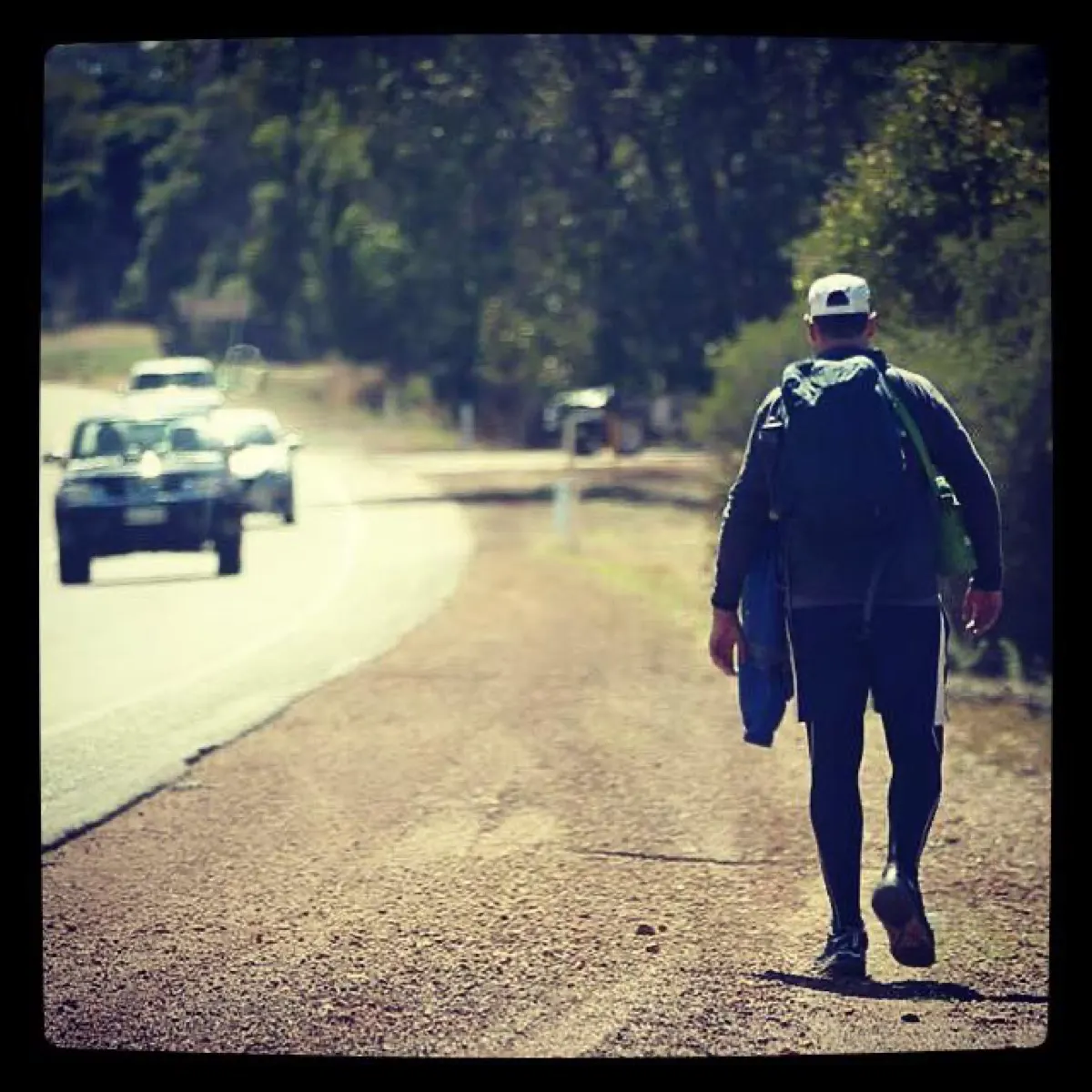 Gary walking along the side of the highway during the Bunbury to Perth practice walk