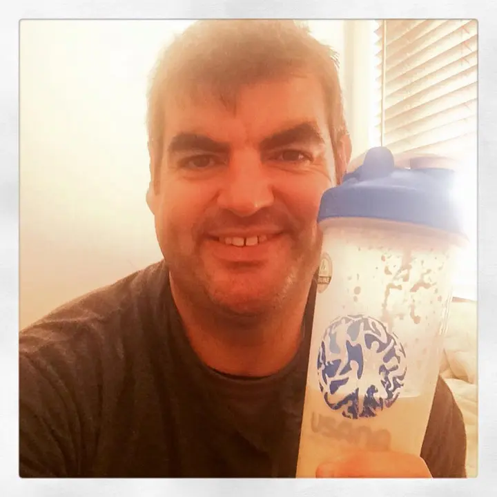 Gary holding a recovery shake after the Joondalup Half Marathon